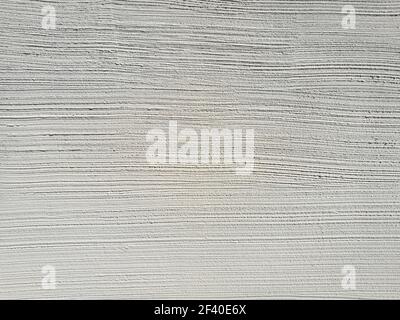 Light gray painted weathered concrete wall texture with horizontal lines Stock Photo