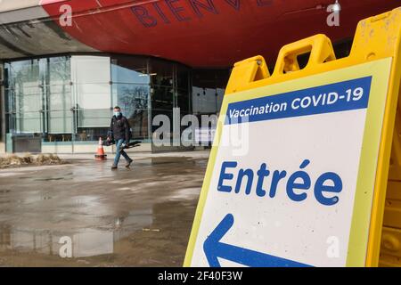 Montreal, CA - 18 March 2021 : Covid-19 vaccination centre sign in front of Olympic Stadium Stock Photo