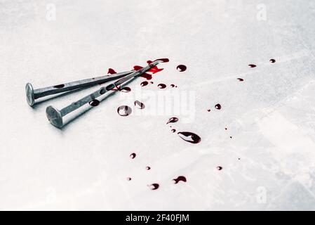 Bloody nails on grey stone background. Banner. Copy space. Good friday. Passion, crucifixion of Jesus Christ. Christian Easter holiday. Gospel Stock Photo