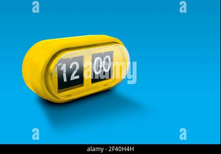 Yellow alarm clock isolated on blue background Stock Photo