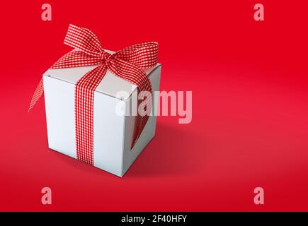 Gift box isolated on red background Stock Photo