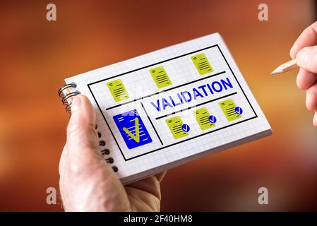 Hand drawing validation concept on a notepad Stock Photo