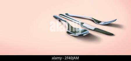 Fork spoon and knife isolated on salmon background with copy space Stock Photo
