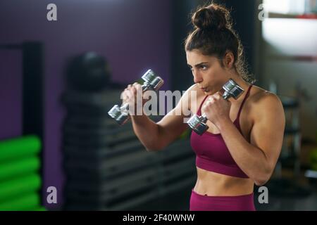Sporty Girl. Fit Female Exercising Muscles. Sports Fitness Sexy Girl.  Sports Boobs. Woman With Dumbbell Fit Slim Abs Body. Muscles With Dumbbell.  Sexy Body, Fitness. Woman Training With Dumbbells Stock Photo, Picture