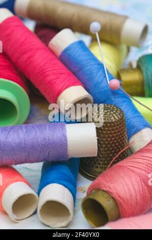 spools, pins and sewing thimble Stock Photo