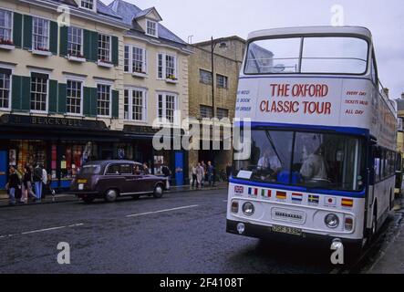 city tour bus stopped in Broad street  in Oxford, United Kingdom Stock Photo