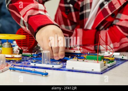 children playing with electronic constructor at studio Stock Photo