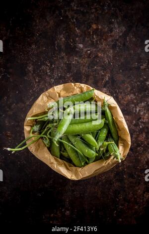 Green Peas Pods in a Paper Bag Stock Photo