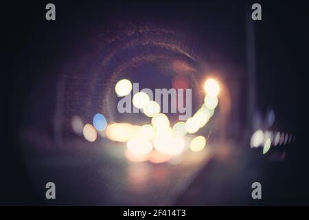 Retro toned blurred street lights, urban abstract background with harsh vignette, copyspace. Retro toned blurred street lights, urban abstract background with harsh vignette Stock Photo