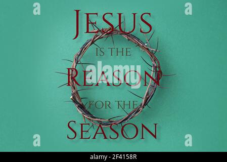 Crown of thorns over green background. Top view. Copy space. Christian Easter concept. Crucifixion of Jesus Christ. He risen and alive. Gospel Stock Photo