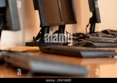 Group of computer neatly placed in a computer lab shallow dof image from table level. Group of computer neatly placed in a computer lab shallow dof Stock Photo