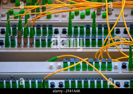 Fiber optic Patch Panel Open With Some Patch Cords Connected. Fiber optic Patch Panel Open Stock Photo