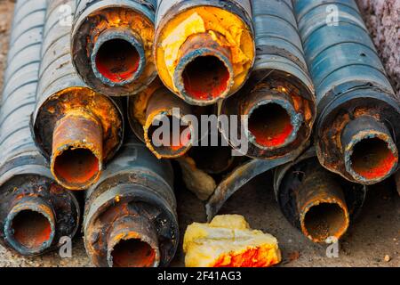 Many old rusty pipes with footprint of welding on side Stock Photo - Alamy
