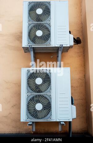 Two industrial air conditioner mounted on the wall. Two industrial air conditioner on the wall Stock Photo