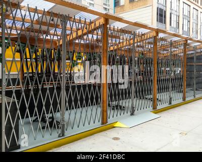 New York, USA. 17th Mar, 2021. Outdoor dining structure in Chelsea in New York is locked with a scissors gate to prevent unauthorized visitors while the restaurant is closed, seen on Wednesday, March 17, 2021. (Photo by Richard B. Levine) Credit: Sipa USA/Alamy Live News Stock Photo