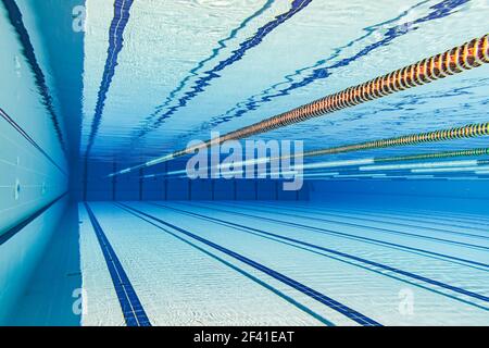 Olympic Swimming pool underwater background. Stock Photo