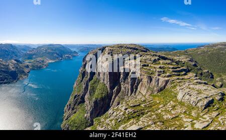 Preikestolen or Prekestolen, also known by the English translations of Preacher&rsquo;s Pulpit or Pulpit Rock, is a famous tourist attraction in Forsand, Ryfylke, Norway Stock Photo