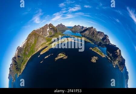 Mini planet Lofoten is an archipelago in the county of Nordland, Norway. Is known for a distinctive scenery with dramatic mountains and peaks, open sea and sheltered bays, beaches and untouched lands. Stock Photo