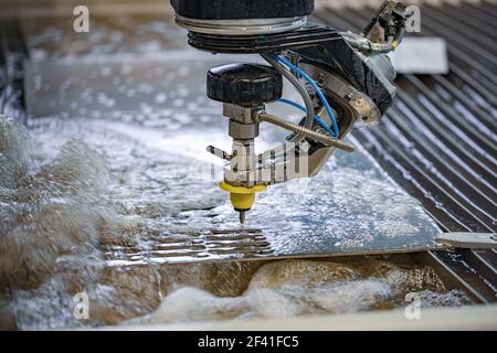 CNC water jet cutting machine modern industrial technology. Stock Photo