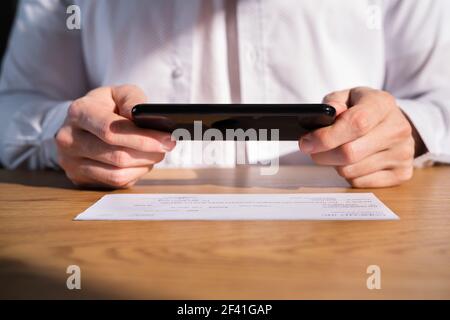 Remote Check Deposit Using Mobile Remote. Online Capture Stock Photo