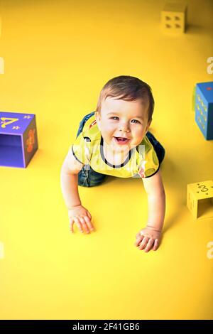Portrait of a cute, little crawling boy Stock Photo