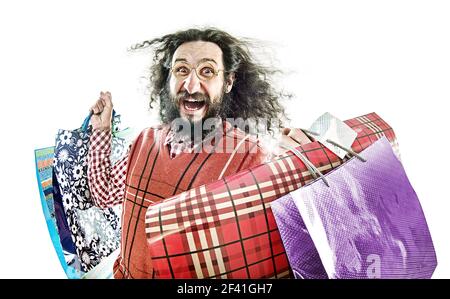 Funny young nerd holding many shopping bags Stock Photo