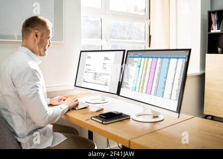 Spreadsheet Analyst Employee Worker. Medical Report On Computer Stock Photo