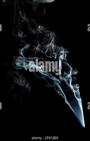 Grey smoke abstract texture, isolated effect with dark background Stock Photo