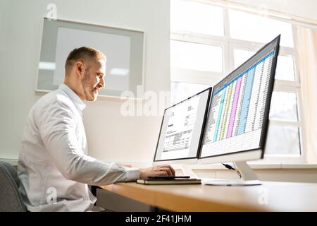 Spreadsheet Analyst Employee Worker. Medical Report On Computer Stock Photo
