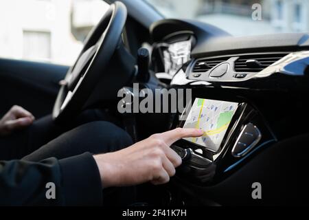 Using Car GPS Navigation And Tracking Maps Stock Photo