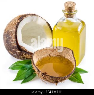 Cracked coconut fruit and  coconut oil isolated on white background. Stock Photo