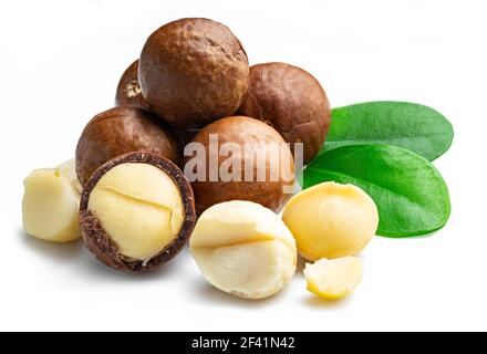 Macadamia nuts with peeled macadamia and leaves isolated on a white background. Stock Photo