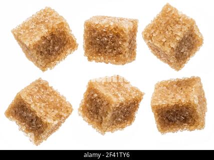 Brown sugar cubes on white background. Macro picture. Stock Photo