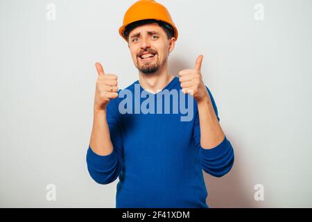 builder helmet. Man Stock Photo