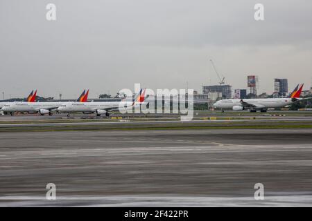 Philippine Airlines planes are seen parked on the tarmac of the Ninoy Aquino International Airport (NAIA) Terminal 2 in Pasay City, Metro Manila, Philippines. Stock Photo