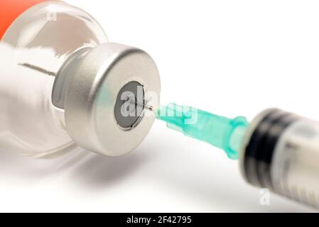 Syringe in a Glass Vial Preparing for an Injection Stock Photo