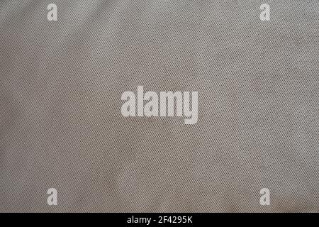 The texture of the upholstery fabric is gray-blue. Corduroy texture. Velvet. Stock Photo