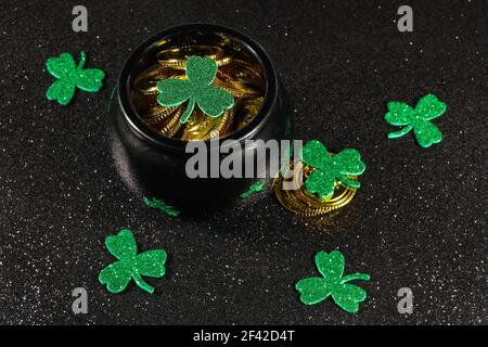 Pot Of Gold Coins With Shamrock Clover Leaves Stock Photo