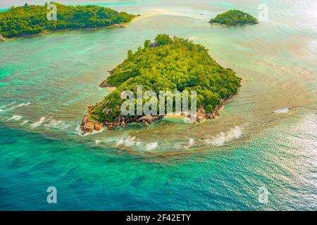 Aerial sunset landscape of the tropical Mahe Island and beautiful lagoons, Seychelles