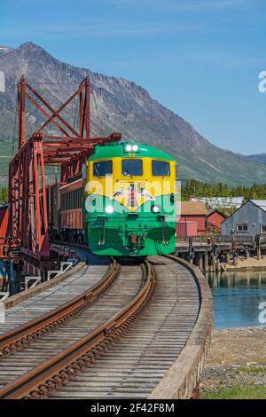 Canada, Yukon, Carcross, swing bridge across the Nares River built 1900, still used by White Pass & Yukon Route tourist train Stock Photo