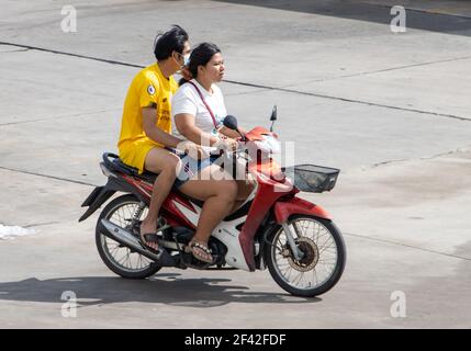 SAMUT PRAKAN, THAILAND, JUNE 26 2020, The pair rides on motorcycle at the street. Stock Photo