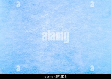 Blue background. Blue colour paper texture. Matte monochrome surface with noises. Stock Photo