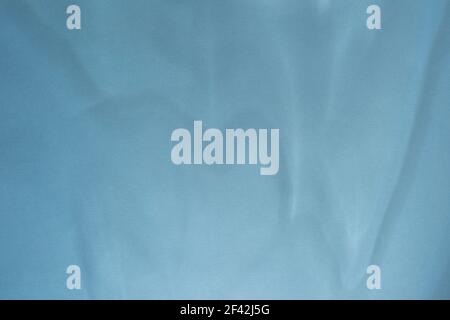 Abstract shadow on blue background. Blue paper surface with smooth shadow. Stock Photo