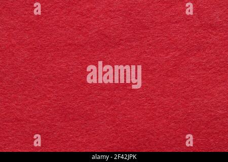 Texture of red felt close-up, close-up. Handicraft concept, crafts, DIY, do it yourself. Top view, flat lay, layout, place for text. For shops with go Stock Photo