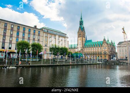 Hamburg, Germany - 18 September 2017: Cloudy autumnal landscape of inner Alster lake, old town and city hall