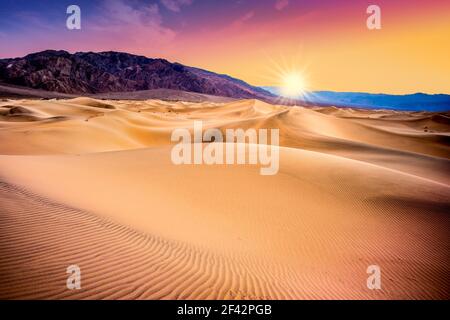 Death Valley, California sand dunes with colorful sunset Stock Photo