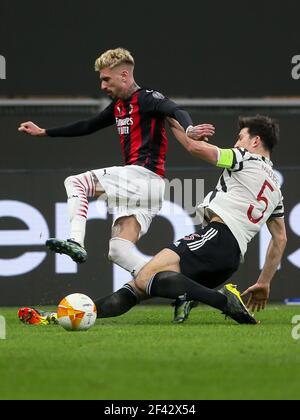 MILAN, ITALY - MARCH 18: Harry Maguire of Manchester United FC and Samuel Castillejo of AC Milan during the UEFA Europa League match between AC Milan Stock Photo