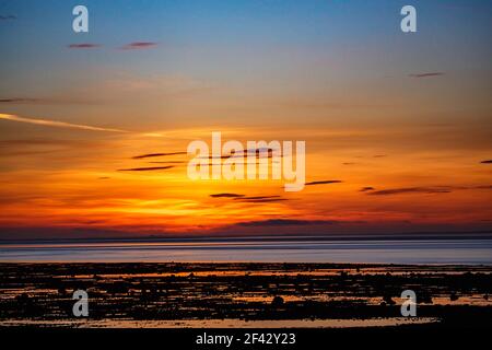 Morecambe, Lancashire, United Kingdom. 18th Mar, 2021. Spectacular sunset after glow over Morecambe Bay Credit: PN News/Alamy Live News Stock Photo