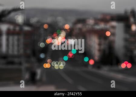 City traffic lights at night. Abstract blurry circles background. Stock Photo