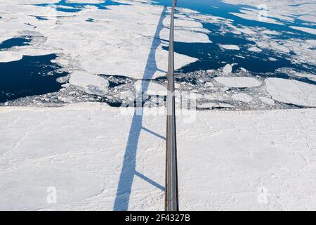 Aerial over Long Bridge and Ice Filled Bay in Canada Stock Photo
